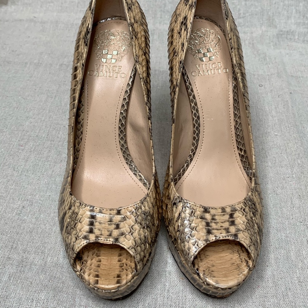 Snake print leather upper peep toe heels.
